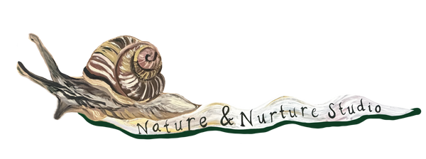 A stylized snail illustration with the text 'Nature & Nurture Studio' across the snail slime, shown on a plain white background.